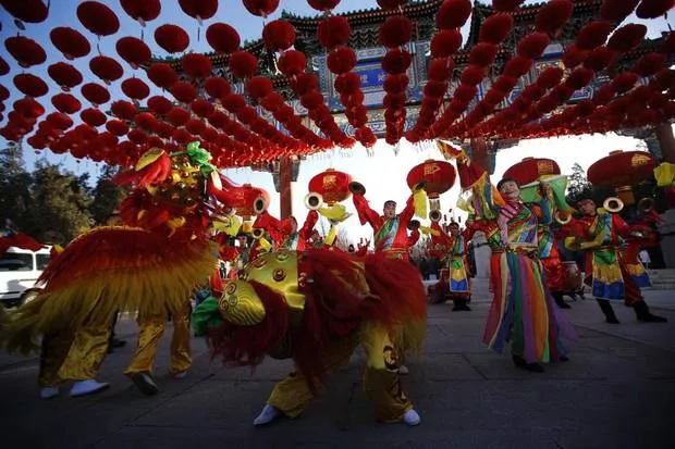 Traditional dancers perform during the opening of the temple fair for celebrating the Chinese New Year at Ditan Park, also known as the Temple of Earth, in Beijing January 30, 2014. (KIM KYUNG-HOON/REUTERS)