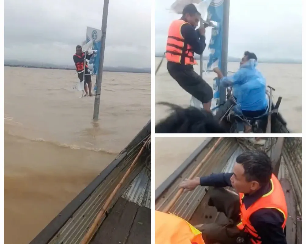 Ông Duy may mắn được ứng cứu. Ảnh cắt từ clip một người ở quảng bình bị lật thuyền