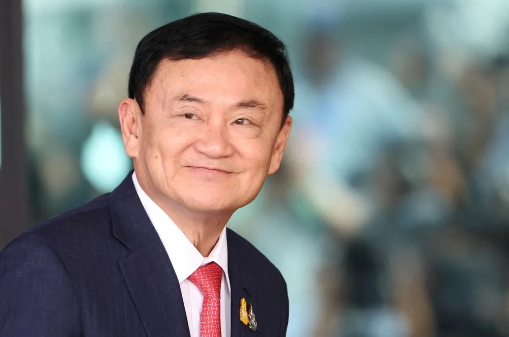 Cựu Thủ tướng Thái Lan Thaksin Shinawatra tại sân bay Don Mueang (Bangkok) hôm 22-8. Ảnh: Athit Perawongmetha/REUTERS Cựu Thủ tướng Thái Lan Thaksin Shinawatra tại sân bay Don Mueang (Bangkok) hôm 22-8. Ảnh: Athit Perawongmetha/REUTERS