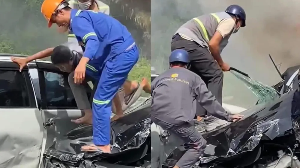 Anh Phan Văn Tài (đội nón cam), anh Vũ Thanh Tùng (ảnh bên phải, đội nón xanh nhạt) và một người dân giải cứu tài xế xe Volvo thành công: Ảnh: Cắt từ clip cứu tài xế xe ở cầu Phú Mỹ