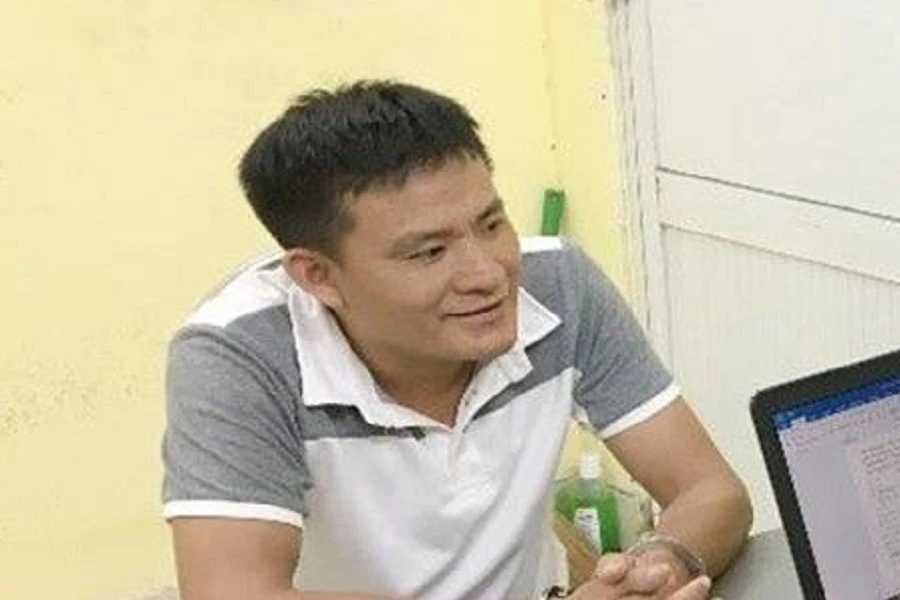 Nguyễn Đức Nhuần tại cơ quan công an. Ảnh: CAĐN