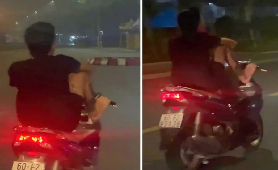 Tâm dùng chân lái xe "dạo" phố bạn quay lại đưa lên mạng xã hội. Ảnh: Cắt từ clip. vi - phạm -giao - thông- 1.jpg