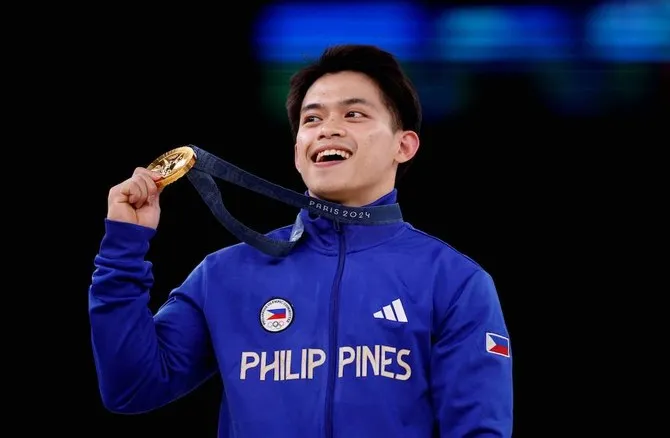 "Chàng trai vàng" Carlos Yulo cũng trở thành triệu phú và sở hữu các bất động sản được tặng. Ảnh:Inq Thay-nguoi-ta-ăn-khoai-Carlos.jpg