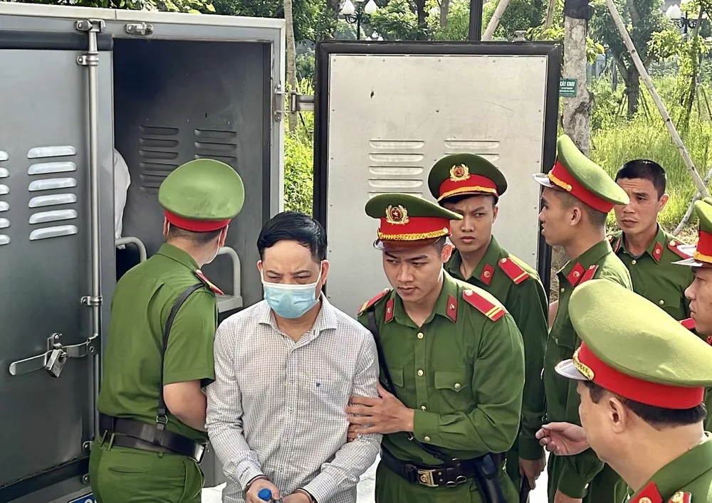 Bị cáo Phạm Trung Kiên được dẫn giải đến phiên tòa. Ảnh: CTV Bị cáo Phạm Trung Kiên được dẫn giải đến phiên tòa. Ảnh: CTV