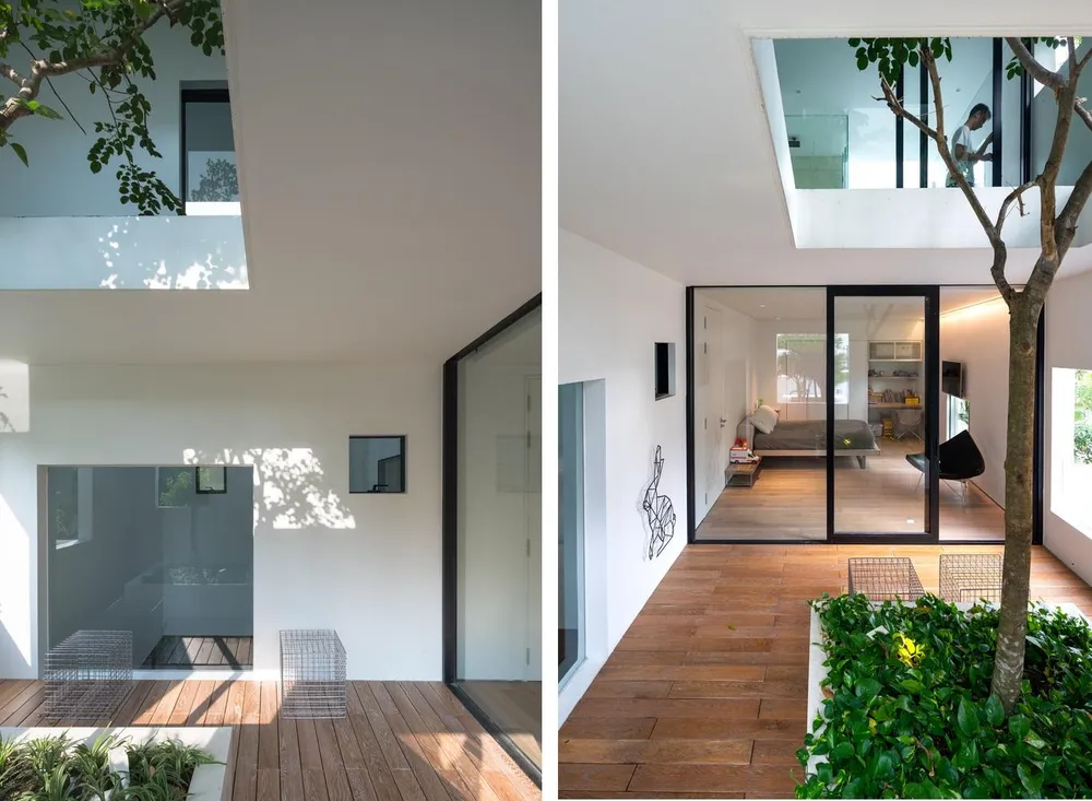 Giữa các phòng ngủ là khoảng trống của cây xanh, giếng trời và thông tầng.