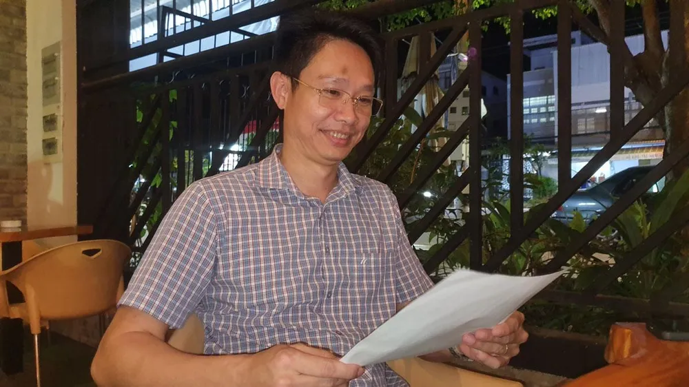 Ông Huỳnh Thanh Lam vui mừng trước kết quả định giá lại tài sản bị thiệt hại trong vụ án chỉ là 1,1 triệu đồng. Ảnh: TRẦN VŨ