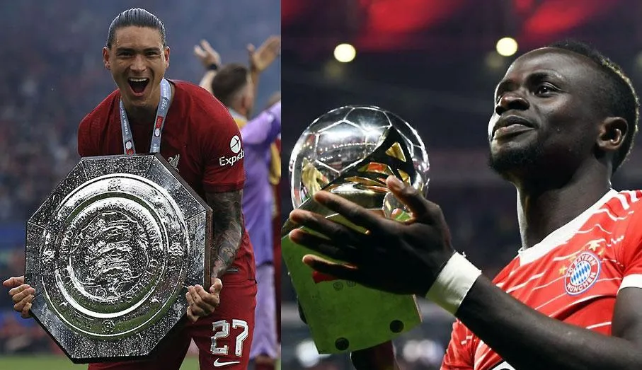 Darwin Nunez với Siêu cúp Anh (ảnh trái) và Mane ôm Siêu cúp Đức. Ảnh: GETTY IMAGES Darwin Nunez với Siêu cúp Anh (ảnh trái) và Mane ôm Siêu cúp Đức. Ảnh: GETTY IMAGES