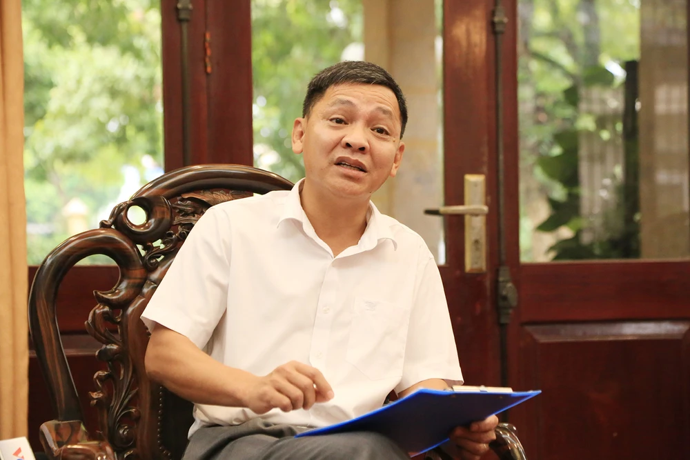 Ông Phạm Quang Ngọc, Phó Chủ tịch UBND huyện Sóc Sơn, thông tin với PV về tình trạng xây dựng trái phép trên đất rừng tại các xã Minh Phú, Minh Trí.