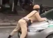 Tài xế taxi tông trung úy CSGT văng lên nắp capo