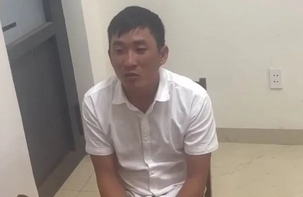 Vũ Bá Nam tại cơ quan công an. Ảnh: S.Đ thanh niên.jpg