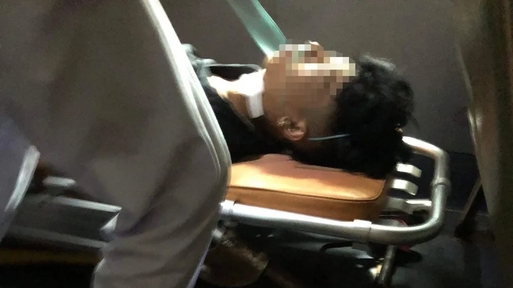 T bị bắn vào cổ, bị thương nặng. Ảnh: HN