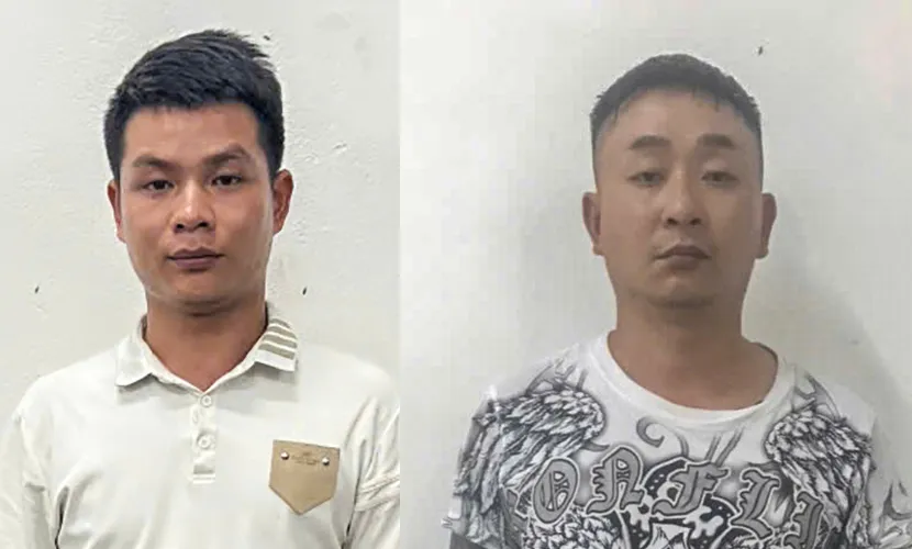 Lê Đức Giao và Hoàng Văn Thắng tại cơ quan công an. Ảnh: CA vay lãi nặng.jpg