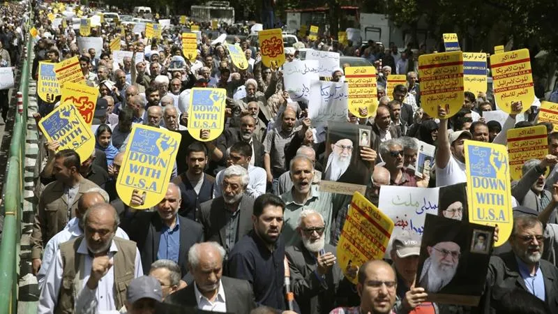 Iranians protest against the US during a rally after Friday prayers in Tehran [Ebrahim Noroozi/ AP]