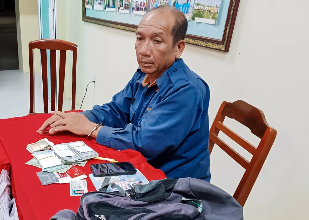 Đối tượng Lê Minh Trang tại cơ quan công an. Ảnh: CAHG