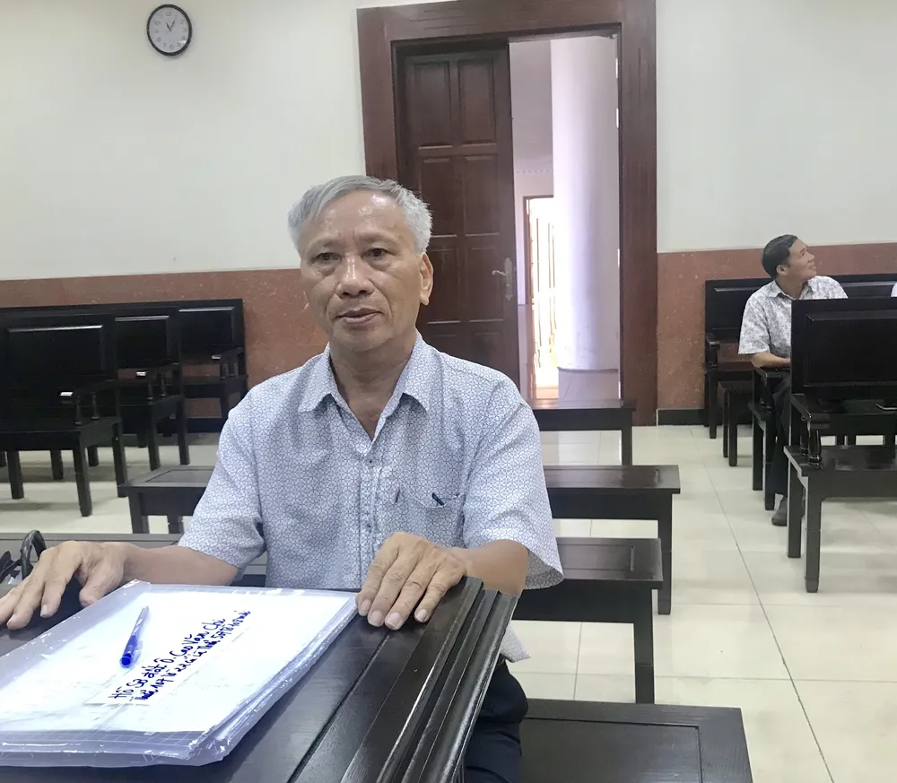 Ông Chu Trọng Huấn tại phiên tòa sáng 23-6. Ảnh: YC