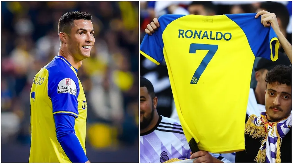 Một cổ động viên Real Madrid giơ cao chiếc áo đấu Al Nassr của Ronaldo trong trận chung kết cúp các CLB. Ảnh: GETTY.