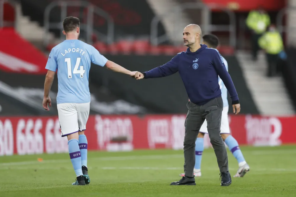 Laporte có thể chia tay ông thầy Guardiola để đầu quân cho Barca. Ảnh: GETTY.