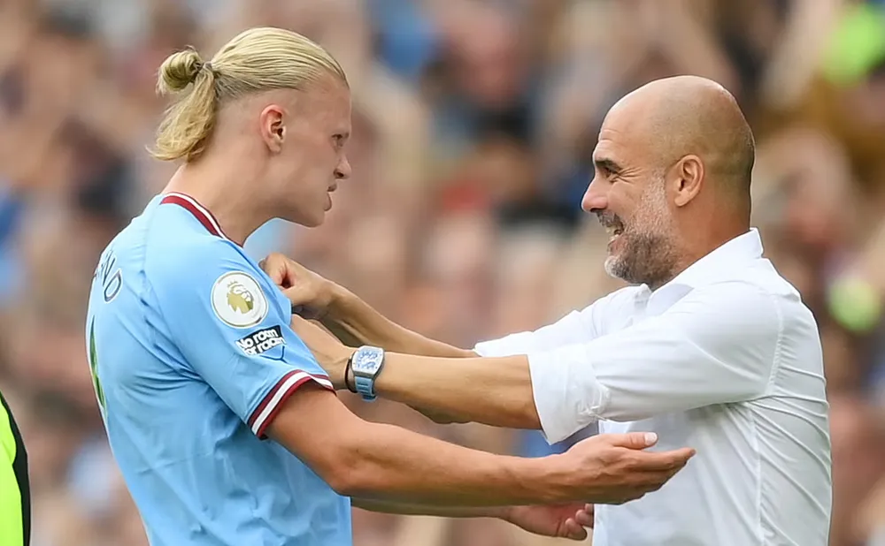 HLV Pep Guardiola mong mỏi Haaland sẽ chơi với phong độ cao. Ảnh: GETTY. pep-haaland.png