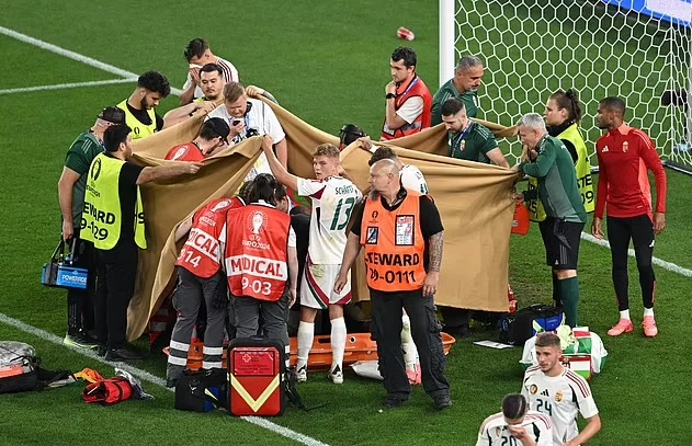 Các cầu thủ Hungary đã che chắn đồng đội của mình không may bị chấn thương nặng. Ảnh: GETTY. cầu thủ Hungary
