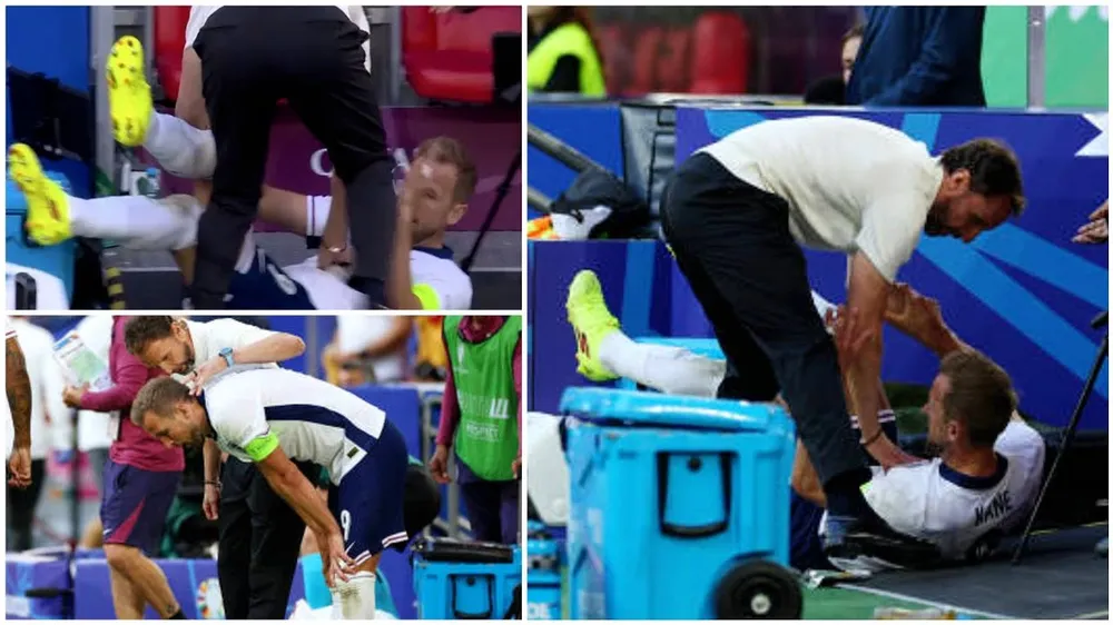 Harry Kane bị hất văng ra khỏi đường biên và HLV Southgate đã giúp ngôi sao tuyển Anh đứng dậy. Ảnh: GETTY. Đội trưởng Harry Kane