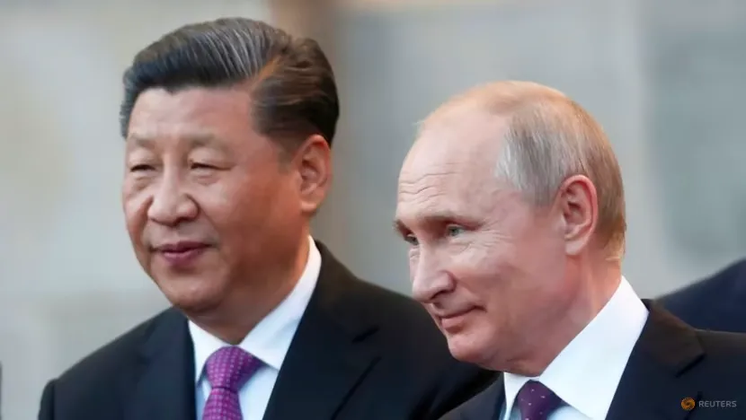 Tổng thống Nga Vladimir Putin (phải) Chủ tịch Trung Quốc Tập Cận Bình. Ảnh: REUTERS a.png