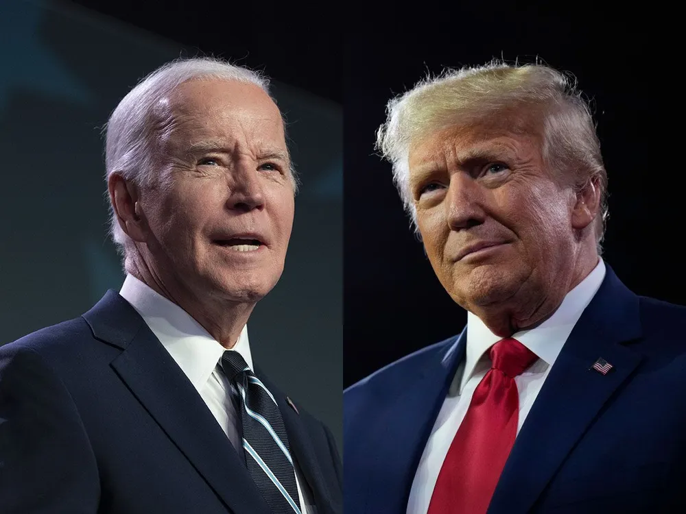 Tổng thống Mỹ Joe Biden (trái) và cựu Tổng thống Donald Trump bước vào phiên tranh luận đầu tiên. Ảnh: GETTY IMAGES Ông Biden và ông Trump bước vào phiên tranh luận đầu tiên