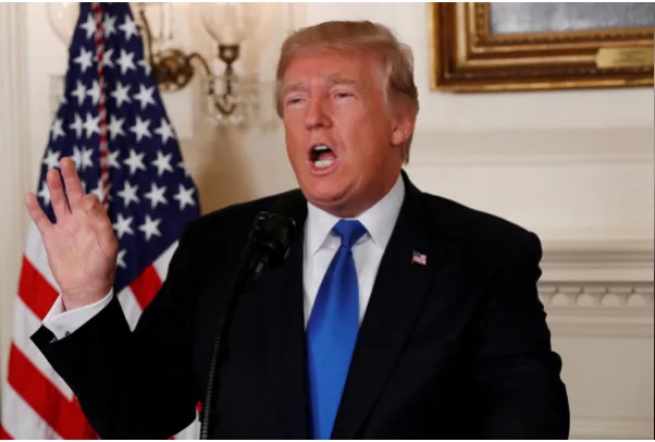 Tổng thống Mỹ Donald Trump nói về thỏa thuận Iran trong một cuộc họp tại Nhà Trắng ngày 13-3. Ảnh: REUTERS