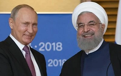 Tổng thống Nga Vladimir Putin (trái) gặp Tổng thống Iran Hassan Rouhani (phải) bên lề hội nghị Tổ chức Hợp tác Thượng Hải (SCO) ở Thanh Đảo (Trung Quốc) tháng 6-2018. Ảnh: AFP