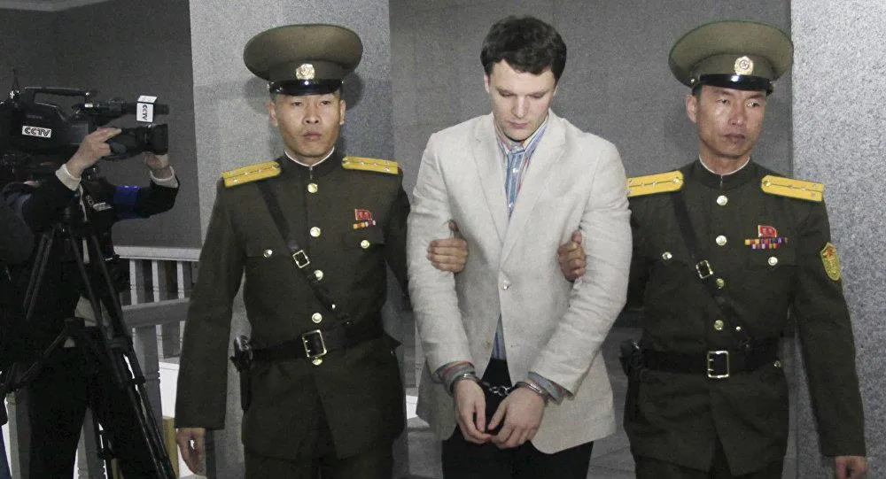 Sinh viên Mỹ Otto Watmbier được hộ tống đến Tòa án Tối cao Triều Tiên. Ảnh: AP