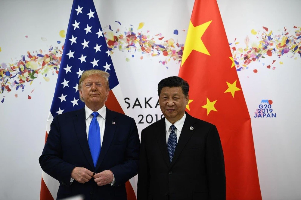 Tổng thống Mỹ Donald Trump (trái) và Chủ tịch Trung Quốc Tập Cận Bình. Ảnh: AFP