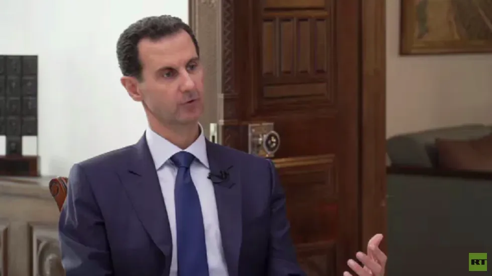 Tổng thống Syria Bashar al-Assad trong cuộc trả lời phỏng vấn phóng viên đài RT. Ảnh: RT