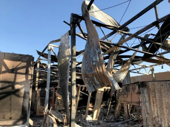 Hiện trường căn cứ không quân Ayn al-Asad ở tỉnh Anbar (Iraq) ngày 13-1, sau khi bị Iran nã tên lửa. Ảnh: REUTERS