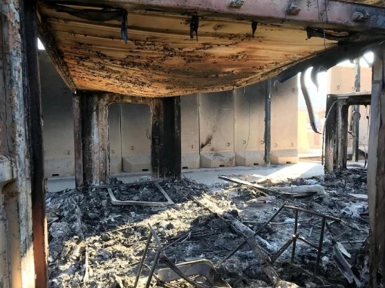 Hiện trường căn cứ không quân Ayn al-Asad ở tỉnh Anbar (Iraq) ngày 13-1, sau khi bị Iran nã tên lửa. Ảnh: REUTERS