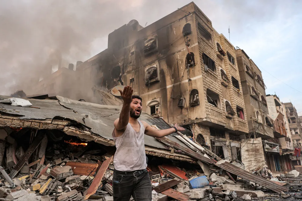 Nhà cửa đổ sập trong giao tranh ở Dải Gaza ngày 11-10. Ảnh: AFP/GETTY IMAGES 7ee6ccad-8f5c-4a02-b3a0-3cb281d0c0f5.jpg