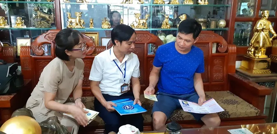 Người lao động đăng ký tham gia BHXH tự nguyện để về già nhận lương hưu. Ảnh: V.LONG Người lao động đăng ký tham gia BHXH tự nguyện để về già nhận lương hưu. Ảnh: V.LONG