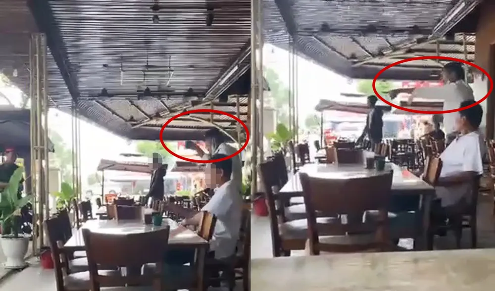 Người đàn ông nói sẽ quăng ly nước vô mặt ai dám dẫn xe đi. Ảnh: Cắt từ clip Untitled-1.jpg