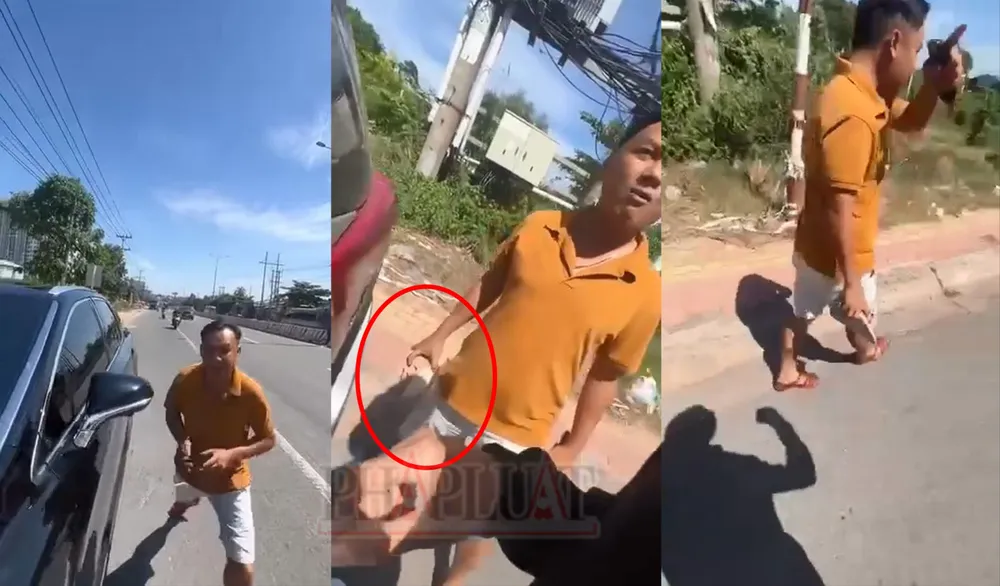 Cán bộ Cảnh sát giao thông có hành động thiếu chuẩn mực. Ảnh: Cắt từ clip cảnh sát giao thông.jpg