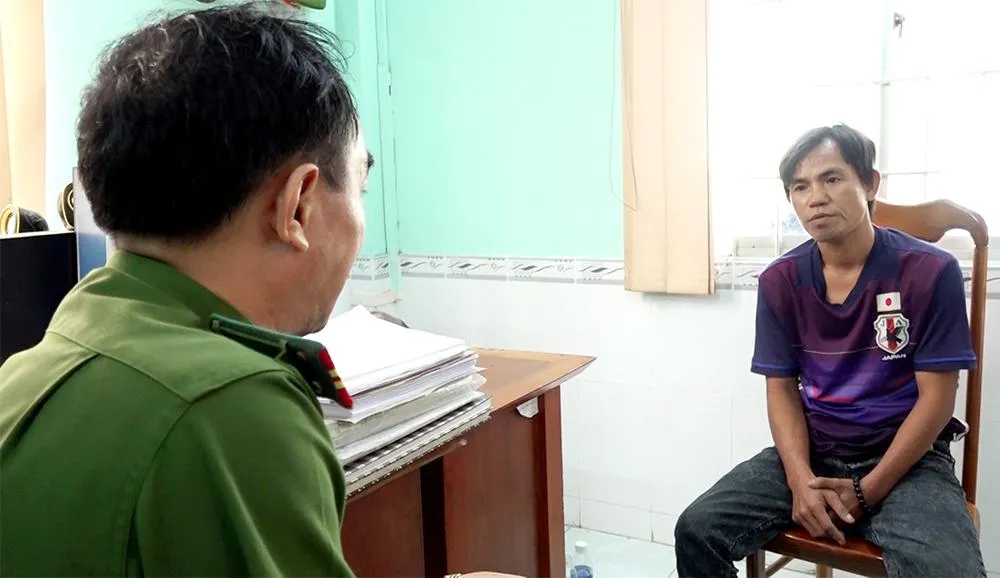 Trần Văn Nam tại cơ quan công an. Ảnh: CACC