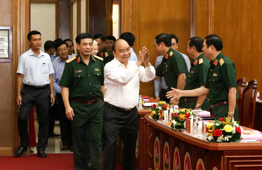 Chủ tịch nước Nguyễn Xuân Phúc chủ trì hội thảo. Ảnh: T.THẢO