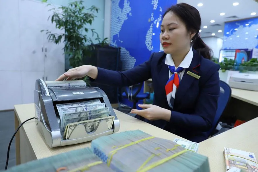 Giá đồng USD tăng trong thời gian gần đây có ảnh hưởng nhất định đến tỉ giá USD/VND. Ảnh: TL