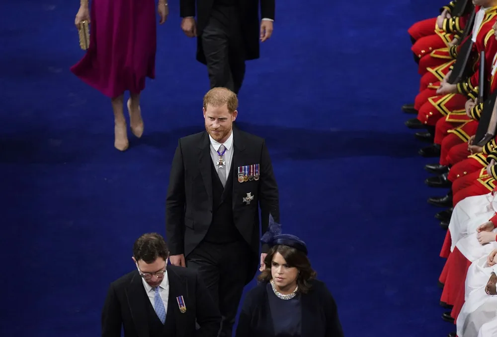 Prince Harry, William's brother, enters Westminster Abbey. <a href="https://www.cnn.com/uk/live-news/king-charles-iii-coronation-ckc-intl-gbr/h_d46a1c2f25cd5c5ed888c323a5411ae9" target="_blank">He accepted the invitation to his father's coronation</a> but was without his wife, Meghan, who stayed back in California with the couple's two children.