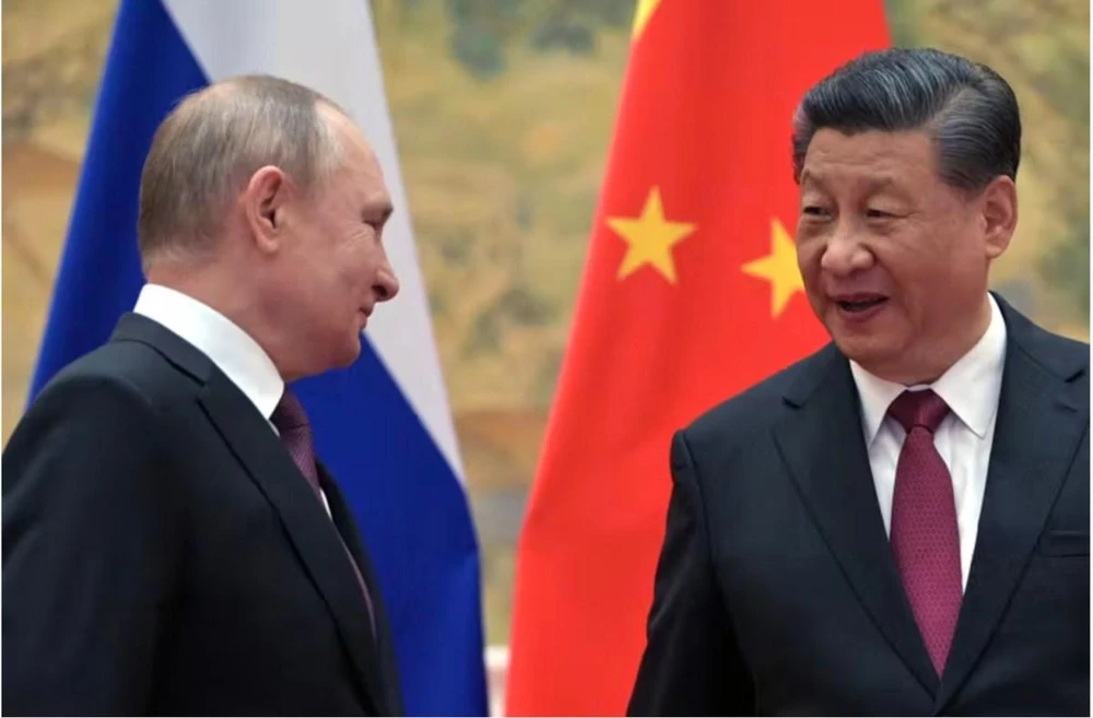 Tổng thống Nga Vladimir Putin (trái) và Chủ tịch Trung Quốc Tập Cận Bình. Ảnh: AFP / Getty