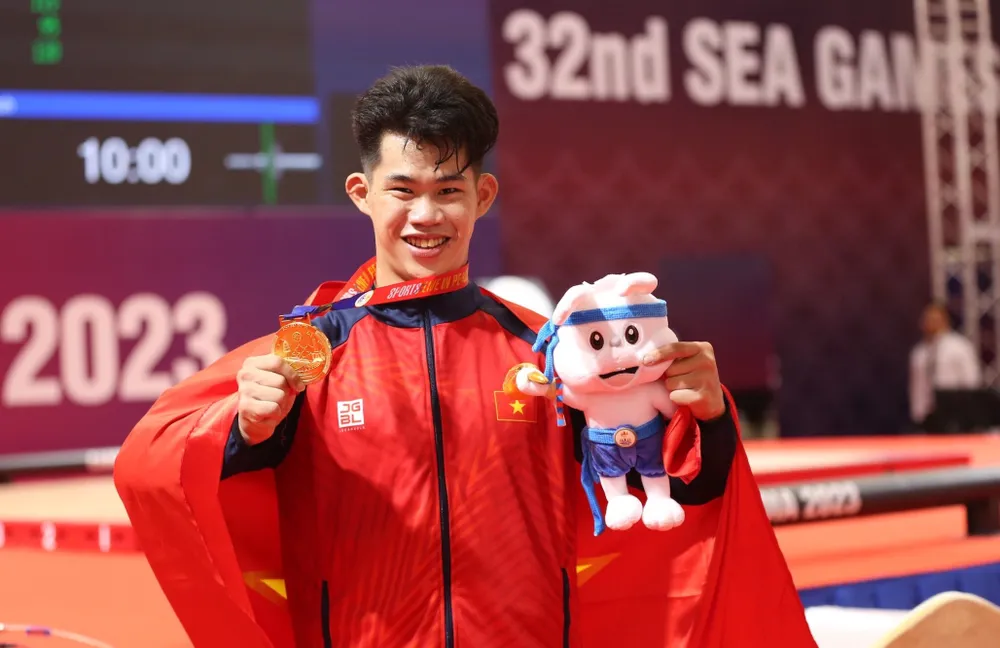Lực sĩ trẻ Trần MInh Trí phá kỷ lục SEA Games hạng 67 kg nam. Ảnh: ANH ĐỒNG Lực sĩ trẻ Trần MInh Trí phá kỷ lục SEA Games hạng 67 kg nam. Ảnh: ANH ĐỒNG