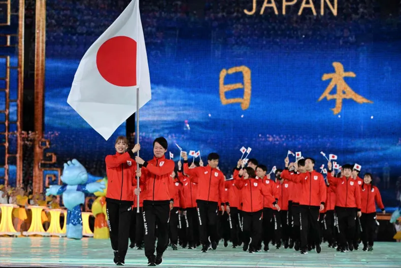 Đoàn VĐV thể thao Nhật Bản diễu hành tại Lễ khai mạc ASIAD 19. Ảnh: AFP asiad-2026-nhat-ban.jpeg