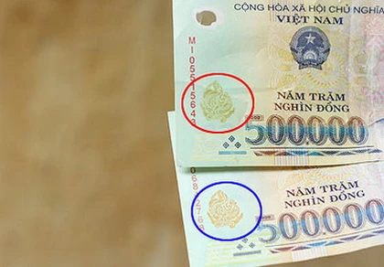 Tiền giả sẽ bị tịch thu, bấm lỗ để tiêu hủy ảnh 1