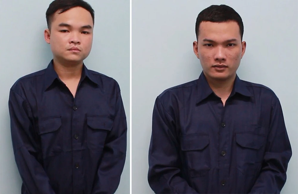 Nghĩa (bên trái) và Hạ tại cơ quan điều tra. Ảnh: CA Nghĩa (bên trái) và Hạ tại cơ quan điều tra. Ảnh: CA