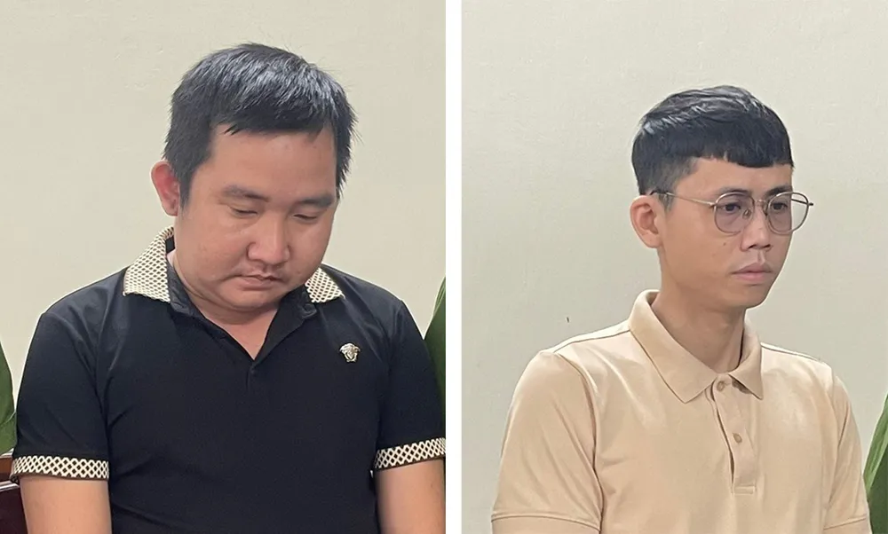 Thành (bên trái) và Hênh tại cơ quan điều tra. Ảnh: CA truong-nhom-va-nhan-vien-tham-o-tai-san-cong-ty-dien-thoai.jpg