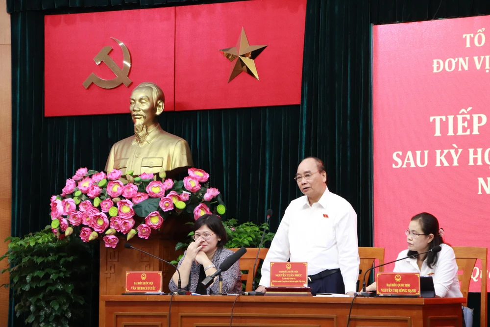 Chủ tịch nước Nguyễn Xuân Phúc trả lời ý kiến của cử tri. Ảnh: NGUYỄN YÊN