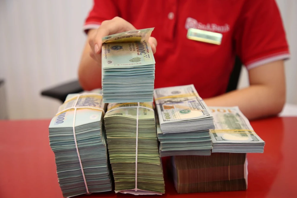 Áp lực khối ngoại bán ròng chủ yếu do ảnh hưởng chênh lệch lãi suất lớn giữa Mỹ và Việt Nam. Ảnh: PHƯƠNG MINH hinh 5 2 3.jpg