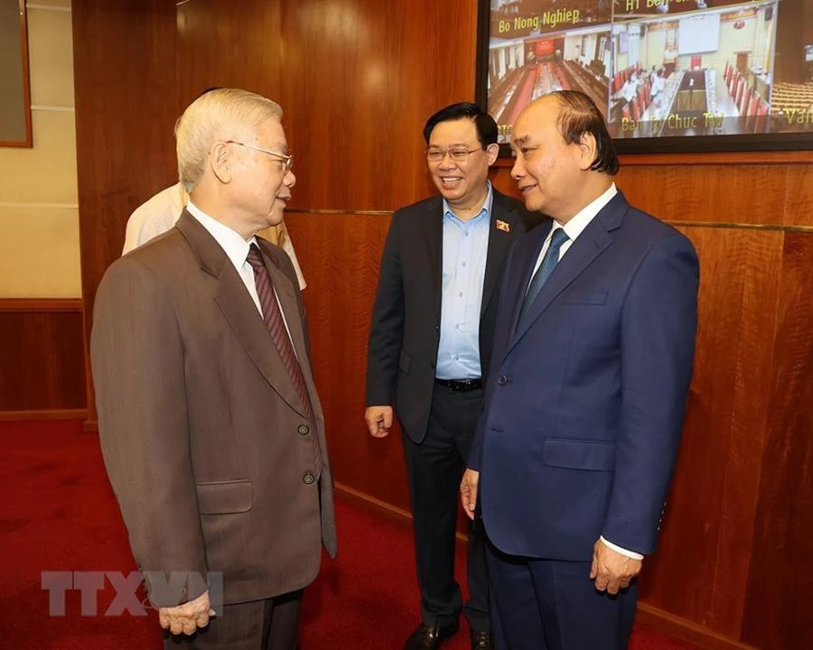 Tổng Bí thư Nguyễn Phú Trọng, Chủ tịch nước Nguyễn Xuân Phúc và Chủ tịch Quốc hội Vương Đình Huệ tham dự hội nghị. Ảnh: TTXVN